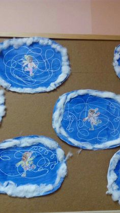 some paper plates that have been made to look like clouds