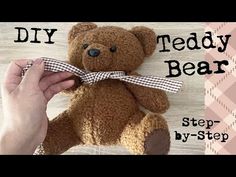 a teddy bear is being held by someone's hand with the words diy teddy bear on it