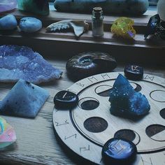 a table topped with lots of different types of rocks and stones on top of it