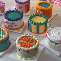 there are many cakes that have happy day written on the frosting and icing