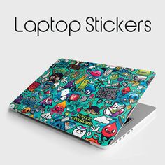 the laptop stickers are all over the screen and in front of it is an image of various cartoon characters