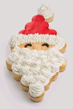 a cupcake with frosting and a santa hat on it