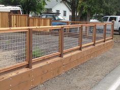 a fenced in area next to a road