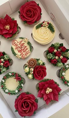 twelve cupcakes decorated with red and white frosting, poinsettis and greenery