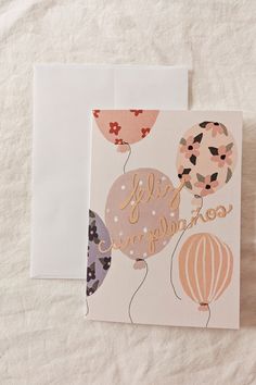 two greeting cards with balloons on them