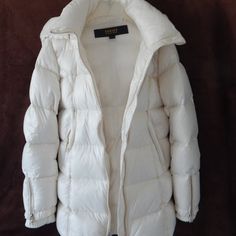 Brand New With Tags Attached Nb Series By Nicole Benisti Gstaad Nsj86811 Shearling & Down Puffer Jacket Authenticity 100% Guaranteed Color Ivory Outer Shell Made Of Nylon Wind Resistant And Water Repellent Removable Hood Trimmed With Dyed Shearling Fur Heavily Quilted With Duck Down Fill: 90% Duck Down & 10% Duck Feather Stand Collar Exposed Zip Front Closure Asymmetric Front Zip Pockets At Hips Long Sleeves Featuring Zipper Closure & Wool Ribbed Cuff Inserts Full Nylon Lining Golden Tone Hardwa Designer Cream Outerwear For Winter, Designer White Winter Outerwear, Nicole Benisti, Down Puffer Jacket, Duck Feather, Duck Down, Down Coat, Color Ivory, Embossed Logo