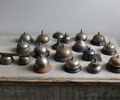 an old wooden box filled with lots of different types of bells