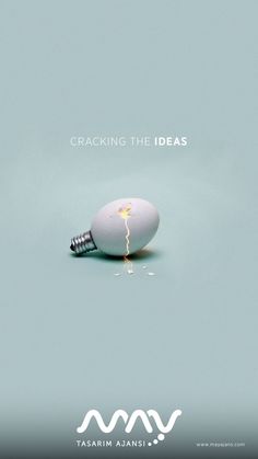 a white light bulb sitting on top of a blue surface with the words cracking the ideas