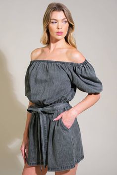 A washed denim romper featuring on/off shoulder neckline, elasticized waist, self sash tie and side pockets Details: Self : 100% Cotton Size & Fit - Model is 5`8" And Wearing Size Small- Measurements Taken From Size Small- Approx. Length: 31" Summer Denim Belted Jumpsuits And Rompers, Casual Off-shoulder Jumpsuit For Day Out, Casual Off-shoulder Jumpsuit For Spring, Spring Off-shoulder Denim Dress, Dark Wash Denim Shortalls, Black Denim Romper, Non-stretch Blue Denim Jumpsuits And Rompers, Medium Wash Button-up Jumpsuits And Rompers With Pockets, Denim Blue Cotton Button-up Jumpsuits And Rompers