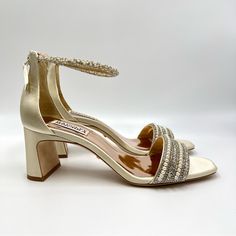 Badgley Mischka Women's Kameryn Jeweled Open Toe Heeled Sandals / Heels / Shoes. Colorway Is Ivory Satin. Style / Model Number Mp6209. Women's Size 7.5. Condition: New / Retail Open Box -- There Are Minor Marks On Leather Soles As Pictured. Box Has Wear. New To Poshmark? Sign Up Using Invite Code: Tentoday For $10 Off Your Purchase! Sparkling Crystals And Pearly Beads Illuminate The Straps Of This Sparkling Statement Sandal Lifted By A Block Heel. Kameryn Exudes Elegance, Style, And Fun For A We Jeweled Dress, Jewel Encrusted, Jewel Dress, Satin Style, Satin Shoes, Badgley Mischka Shoes, Elegance Style, Life Of The Party, Heels Shoes