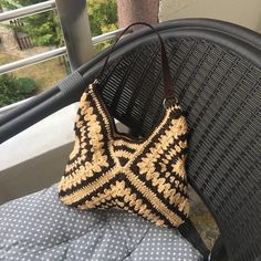 Welcome to our shop! 🌟 This handmade granny square bag with a brown leather strap is the perfect accessory to complement your style. Each granny square motif features a unique pattern, making this bag truly one-of-a-kind. The durable leather strap provides sturdy construction for long-lasting use, while the spacious interior allows you to comfortably carry your daily essentials. 👜 Carry elegance and craftsmanship with every step with this bag. It's also a perfect choice as a special gift for l Hand Knitted Rectangular Crochet Bag For Crafting, Brown Granny Square Crochet Bag For Vacation, Brown Hand-knitted Rectangular Bag, Brown Crochet Bag With Granny Square For Vacation, Square Beige Beach Bag, Brown Crochet Square Shoulder Bag, Beige Granny Square Crochet Tote Bag, Brown Granny Square Crochet Tote Bag, Everyday Brown Crochet Bag With Granny Square