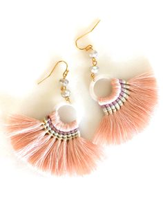 "Seashell pink fan tassel earrings with pearlescent Czech glass bead accents on gold plated French hooks. Darling shell pink fan tassels are pale pink woven with accents of mauve, seafoam green and beige. Lightweight tassels are 70 x 45mm with pearl acetate rings. Wire wrapped above are Czech mercury glass like rondelles with lovely pearlescent shine. Tassels hang from gold plated French hooks. Total drop is 3\". Very lightweight and summery!" Pink Fringe Jewelry For The Beach, Beach Jewelry With Pink Fringe, Pink Fringe Jewelry For Beach, Pink Beaded Tassel Earrings For Beach, Handmade Pink Dangle Tassel Earrings, Elegant Pink Tassel Earrings, Pink Tassel Drop Earrings, Adjustable Pink Tassel Jewelry, Pink Dangle Tassel Earrings