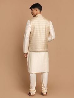 VASTRAMAY Men's Beige Textured Slim-Fit Nehru Jacket With Cream Colored Kurta Pajama Set This stylish set combines a beige textured slim-fit Nehru jacket with a cream-colored kurta pajama, offering both elegance and comfort. Key Features: Slim-fit Nehru jacket Textured design Cream-colored kurta pajama Specifications: Brand: VASTRAMAY Color: Beige and Cream Fit: Slim-fit Material & Care: Top fabric: Viscose Rayon Bottom fabric: Viscose Rayon Jacket Fabric : Silk-blend Dry-clean Legal Disclaimer: Transitional Beige Fitted Nehru Jacket, Festive Fitted Beige Nehru Jacket, Festive Beige Nehru Jacket With Long Sleeves, Festive Beige Long Sleeve Nehru Jacket, Festive Long Sleeve Beige Nehru Jacket, Festive Beige Nehru Jacket With Naqshi Detailing, Beige Nehru Jacket With Zari Work, Beige Long Sleeve Nehru Jacket With Dabka, Beige Nehru Jacket With Dabka