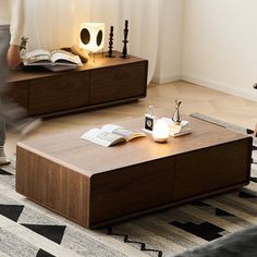 a living room with two coffee tables and a person walking in the middle of the room