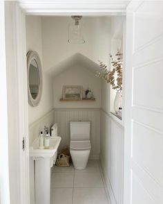 a bathroom with white walls and floors is shown on the instagram page for this photo