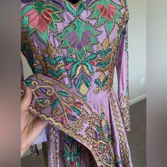 This Gorgeous Pre-Loved Thobe Is Too Beautiful To Have Only Been Worn Once! It’s Heavy, Embellished Throughout, And Includes Scarf, Belt, And Sheer Sleeveless Vest With A Train That Is Covered In Crystals Of Different Shades To Match The Thobe Perfectly. Perfect For A Unique Henna Dress. Traditional Hand Embellished Purple Dress, Traditional Embellished Purple Dresses, Traditional Purple Embellished Dress, Purple Bollywood Dress Hand Embellished, Traditional Embellished Party Dress, Bollywood Style Party Dress With Handwork, Bollywood Party Dress With Handwork, Bollywood Style Handwork Party Dresses, Festive Embellished Thobe