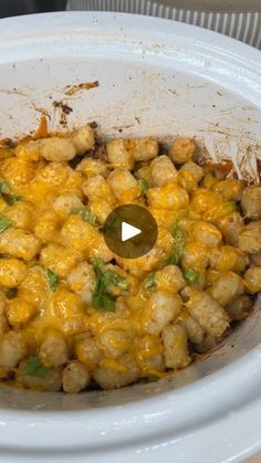 a white crock pot filled with food on top of a table