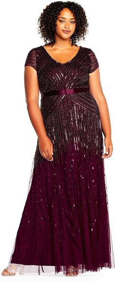 a woman in a long purple dress with sequins