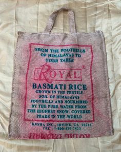 a bag that is sitting on top of a bed with the words royal printed on it