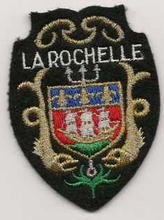 an embroidered patch with the words larochelle on it and a shield emblem