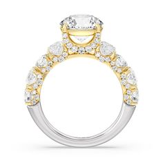 a yellow and white gold engagement ring with an oval center stone surrounded by small diamonds