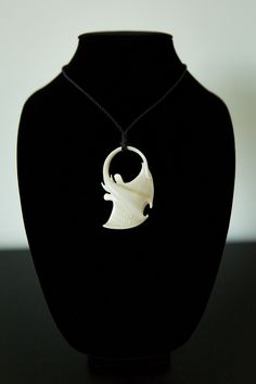 Authentic, hand carved bone pendant with a natural brown rope necklace that is adjustable! Necklaces are limited quantities because they are handmade.    These pendants are carved from bone which means that marks and texture on show authenticity and uniqueness.  If you have any questions or requests, please message me or my shop, Tane Designs. Carved Pendant Necklace Adjustable, Unique Carved Bone Jewelry, Carved Pendant Jewelry, Adjustable Carved Pendant Necklaces, Unique Bone-colored Carved Jewelry, Adjustable Carved Pendant Jewelry, Adjustable Carved Pendant Necklace, Adjustable Carved Amulet Style Necklaces, Artisan Carved Adjustable Jewelry