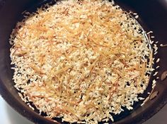 rice is being cooked in a skillet on the stove