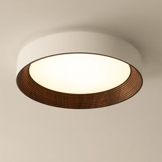 a circular light fixture hanging from the ceiling