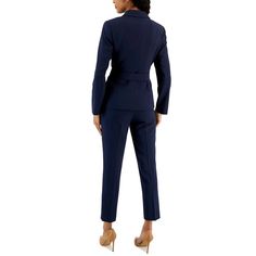 Step into the spotlight with the ultimate power outfit - the Belted Pantsuit from Tahari ASL. This impeccably tailored ensemble features a belted jacket with a sleek notch collar, wrap closure with snaps, and an asymmetrical hem for a modern touch. The coordinating pants boast a flattering mid-rise, straight fit, and convenient pockets for added functionality. Crafted from a luxurious blend of polyester and elastane, this pantsuit offers both style and comfort for all-day wear. The addition of s Fitted Blazer With Belt Loops For Work, Fitted Office Blazer With Belt Loops, Fitted Blazer With Notch Lapel And Belt Loops, Belted Fitted Blazer For Business Casual, Spring Formal Pantsuit With Belted Cuffs, Elegant Fitted Blazer With Tie Waist, Fitted Blazer With Belted Cuffs For Office, Fitted Double Button Pantsuit For Work, Elegant Notch Lapel Blazer With Tie Waist