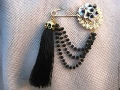 the black beaded earrings are hanging from hooks