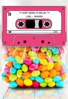 a bag filled with colorful candy covered in cassette tape