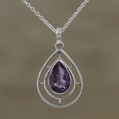 Featuring a three carat stone of purple amethyst in the shape of a droplet, this Indian pendant necklace brings a fabulous aesthetic to any outfit. Babun Dey designs the accessory, crafted of sterling silver with shining spokes that fill the drop shape. Gemstone Teardrop Pendant Drop Necklace, Purple Teardrop Gemstone Necklace, Lavender Amethyst Teardrop Necklace, Lavender Teardrop Amethyst Necklace, Elegant Lavender Teardrop Necklace, Lavender Amethyst Drop Necklace, Elegant Lavender Drop Necklaces, Teardrop Amethyst Gemstone Necklace, Teardrop Lavender Gemstone Jewelry