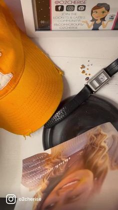 a yellow hat sitting on top of a table next to a frying pan and magazine