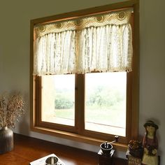 a kitchen window with an old fashioned sink and coffee pot on the counter next to it