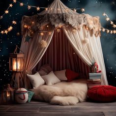 a canopy bed with stars on the ceiling and lights hanging from it's sides