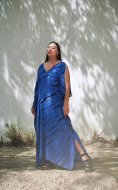 Step into effortless boho style with our Blue Tie-Dye Plus Size Kaftan, the perfect piece for beach days, casual outings, or dreamy vacations. This oversized caftan is designed for comfort, with a loose, flowing fit that makes you feel beautiful and free wherever you go. Crafted with love and care, this cold-shoulder dress is hand-tie-dyed in vibrant blue, giving you a unique, one-of-a-kind look that's both stylish and sustainable. Whether you're planning your next vacation, looking for a comfy Dress Blue Long, Plus Size Kaftan, Resort Dress, Boho Tie Dye, Thoughtful Gifts For Her, Marine Uniform, Long Kaftan, Hand Tie, Resort Dresses