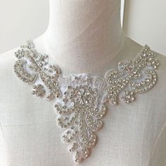 "Shinny Bridal Rhinestone Applique V Neck Diamante Appliques Sash Applique DIY Bridal Dress Applique Crystal Sweet Heart wedding applique Size: Width: 4.7\" (12 cm) Length: 8.7\" (22 cm) Perfect for a DIY bridal garter, bridal dress, wedding dress, bridal sash, belts, headpiece, baby headband (as well as many other DIY projects). Stones are all prong set, and sewn into the mesh backing. Price is for one piece, more in stock. We offer special discounts for designers and wholesale orders! You can Fitted White Crystal Bridal Accessories, Dress Applique, Wedding Applique, Diy Bridal, Millinery Hats, Rhinestone Appliques, Bridal Sash, Bridal Garter, Sash Belts