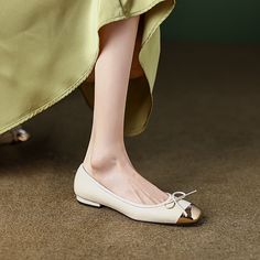 Looking for the perfect pair of ballet flats? Check out our beige ballet flats! Boasting a gold cap toe and bow. our ballet flats are perfect for everyday wear. as well as special occasions. Upper: Sheepskin Lining: Leather Outsole: TPR Toe: Cap Toe Closure: Slip on Color: Pink. Beige is_handmade: Yes Chic Beige Ballet Flats With Round Toe, Elegant Gold Flats For Spring, Elegant Gold Pointed Toe Flats For Spring, Gold Elegant Pointed Toe Slip-on Flats, Elegant Gold Almond Toe Ballet Flats, Spring Gold Pointed Toe Slip-on Flats, Gold Pointed Toe Slip-on Flats For Spring, Chic Gold Pointed Toe Flats For Spring, Chic Gold Flats For Spring