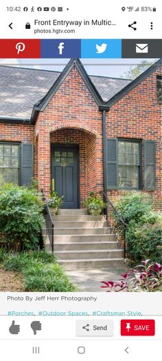 an image of a brick house with shutters on the front and stairs leading up to it