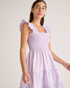 This floaty, flirty, light dress is about to become your fave for summer. Flattering A-line cut, smocked elasticated top, tiered poplin skirt. The sleeveless style has ruffle detailing and all in breathable, natural 100% organic cotton poplin. It's soft, comfy, and the midi-length has the potential to be dressed up or down.  | Quince | Women's Smocked Midi Dress in Pastel Lilac, Size Small, Organic Cotton Spring Cotton Smocked Tiered Dress, Spring Cotton Tiered Smocked Dress, Square Neck Smocked Sundress With Ruffles, Spring Tiered Cotton Smocked Dress, Square Neck Smocked Bodice Tiered Dress For Brunch, Feminine Smocked Dress With Ruched Tiered Skirt, Feminine Ruched Tiered Skirt Smocked Dress, Spring Cotton Smocked Dress With Tiered Skirt, Feminine Ruched Smocked Dress With Tiered Skirt