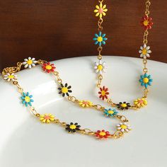 Bohemian Spring Bracelet, Multicolor Adjustable Chain Jewelry For Friendship, Bohemian Gold Jewelry With Flower Decoration, Summer Friendship Flower Jewelry, Dainty Multicolor Flower Necklace, Trendy Multicolor Flower Jewelry, Bohemian Flower Bracelets For Summer, Multicolor Flower Jewelry For Beach, Bohemian Flower Charm Jewelry For Beach