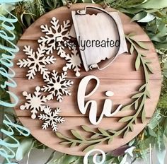 a wooden sign with snowflakes on it and the word'evergreened '