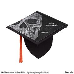 a black and white graduation cap with a skull on it