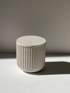 This minimalist lined concrete jar is the perfect solution for organizing and storing items combining functionality with aesthetics to elevate your home decor.  The concrete material exudes durability and sophistication. Its versatility makes it suitable for various rooms and purposes.  Its storage capacity, makes it ideal for organizing small essentials such as office supplies, bathroom accessories such as cotton balls/q-tips, room accessories, or even as a planter for small indoor plants.  Whether displayed on a shelf, countertop, or desk, this jar effortlessly enhances the visual appeal of your space while keeping your belongings neatly organized.  With its featured lid, this storage jar additionally secures your items, keeping them dust and moisture free.  Dimensions:  Jar:  3.5in H x Concrete Material, Small Indoor Plants, Concrete Materials, Cotton Balls, Storage Jar, Small Organization, Room Accessories, A Shelf, Storage Container