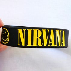 Nirvana (Rubber Bracelet Wristband) Rock Band Logo New Kurt Cobain Grunge Music Black Nirvana Bracelet Wristband Brand New! Silicone/ Rubber Unisex Men / Women Stretches One Size Fits All Fast Same Day Shipping!!! Rock Band Bracelets, Cheap Punk Wristband For Concerts, Nirvana Bracelet, Nirvana Necklace, Nirvana Accessories, Kurt Cobain Grunge, Nirvana Patch, Band Pins, Rock Band Logos