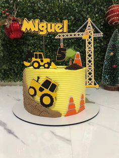 a construction themed birthday cake on a table