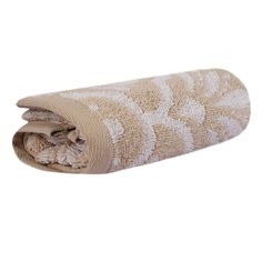 a rolled up towel with white flowers on it