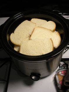 toasted bread is in the crock pot on the stove top, ready to be cooked