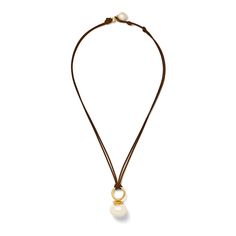 A low-key approach to the traditional pearl necklace. The Details: resilient cording (nylon + cotton blend) 18 x 16mm large, white pebble pearl, sits flat on neck pearl button + loop closure overall length 16-18”, adjustable polished 14 karat gold over brass We know you'll love your pieces, just in case, enjoy our two week return policy. Traditional Pearl Necklace, Pearl Drop Pendant, White Pebbles, Drop Pendant, Pearl Drop, Matte Gold, Low Key, Large White, Just In Case