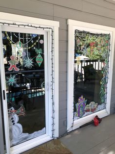 two windows with christmas decorations on them